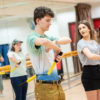 6 invicta students learning how to use the nunchaku in the nunchaku lesson